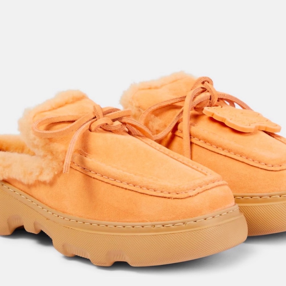 BURBERRY
Stony faux fur-lined suede mules